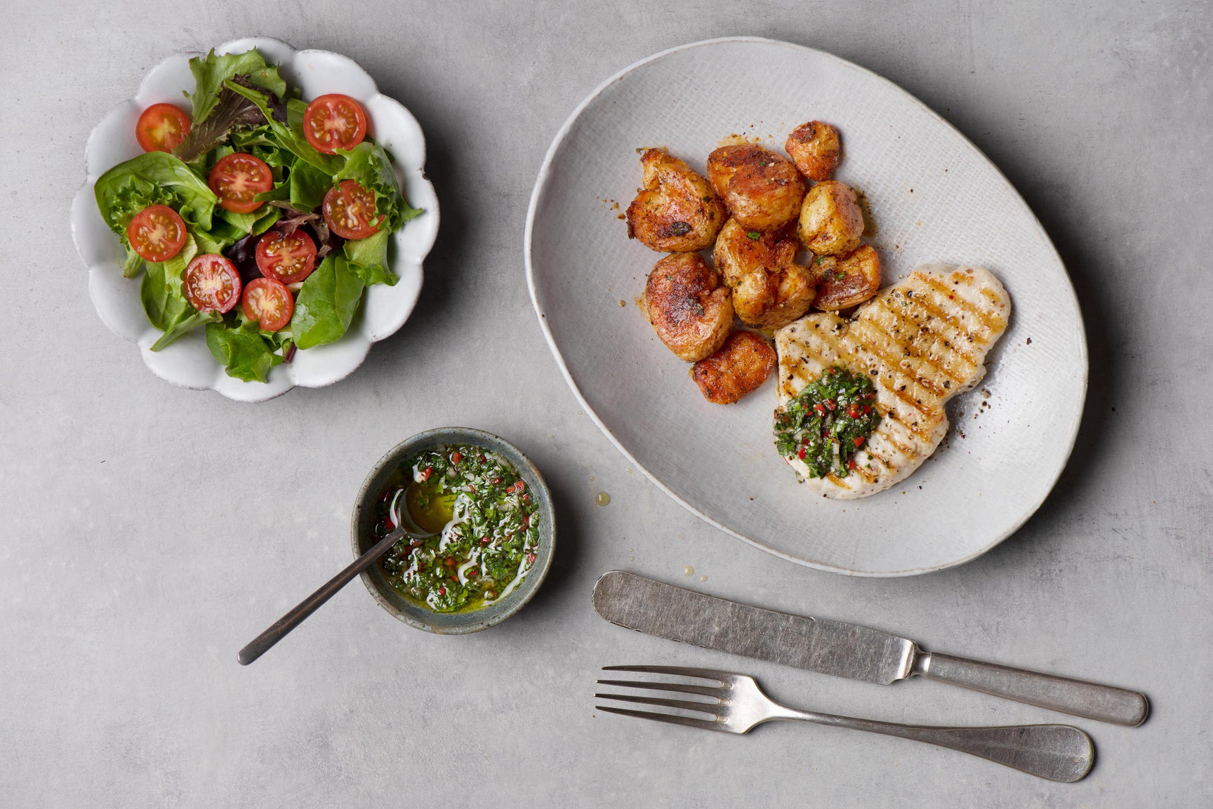 Seared albacore tuna steaks with chimichurri and crispy new potatoes